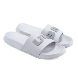 Ojotas Umbro de goma color gris claro, con logo de la marca en verde en la tira.