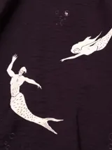 Musculosa de viscosa y poliamida con estampado de flores, con lazos en los costados.