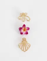 Set de tres broches para el pelo con forma de flor, mariposa y concha marina.