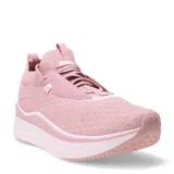 Championes Puma Softride Stakd Premium color rosa, con capellada de tejido de punto, cordones elásticos y suela de plataforma blanca.