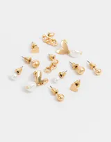 Set de seis pares de aros dorados con diferentes diseños: perlas, corazones texturados y esferas.
