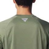 Remera de manga larga Columbia Terminal Tackle Heat, color gris jaspeado, con logo de la marca en el pecho y en la manga. Confeccionada en tejido transpirable de secado rápido y protección solar UPF 50.