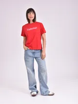 Remera celeste de algodón con estampado de flor y texto "Real View".
