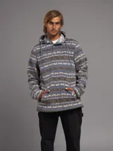 Canguro Rusty con capucha, estampado con motivos geométricos en tonos azul, gris y beige. Tiene cierre de botones en el cuello y bolsillos tipo canguro.