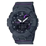 Reloj Casio G-Shock modelo GMAB800-8ADR, con caja de resina gris, esfera negra y detalles en violeta. Cuenta con conectividad Bluetooth, podómetro, cronómetro, temporizador, alarma y luz LED. Resistente al agua hasta 200 metros.