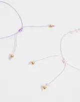 Set de dos pulseras de cordón ajustable con mostacillas de colores y dije de ojo turco.