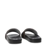 Sandalias Puma Leadcat 2.0 Animal Flair, con base negra y tira ancha con estampado animal print y logo Puma dorado.