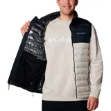 Chaleco Columbia Powder Lite II Vest para hombre, color beige con parte superior negra. Cuenta con tecnología Omni-Heat de revestimiento térmico reflectante, tecnología Omni-Shield que repele la humedad y aislamiento Thermarator de poliéster reciclado.