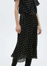 Falda midi negra con estampado de lunares color dorado.
