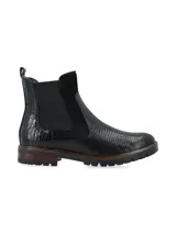 Botín de caña corta color negro, de origen europeo, con combinación de materiales: cuero croco, cuero snake y cuero nobuk. Presenta elásticos laterales al tono y forro de pelo sintético.