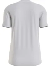 Remera gris de corte slim fit con cuello redondo y logo "Calvin Klein Jeans" estampado en el pecho.