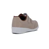 Championes Kolosh color beige con detalles en marrón, ajuste con doble velcro y suela blanca.
