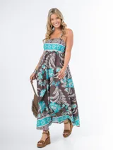 Vestido largo azul marino con estampado floral en tonos amarillo y blanco, de algodón italiano, con escote cuadrado, corte imperio y tirantes finos.