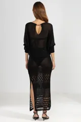 Falda larga de tejido de punto calado color negro, con lurex y detalle de cobre con logo Polonio.