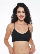 Top deportivo negro con breteles finos y espalda estilo nadador. Elástico ancho en la base con logo de la marca. Sin aro ni relleno.