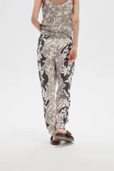 Pantalón de viscosa estampado, anudado, holgado y de calce medio.