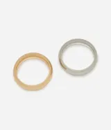 Kit de dos brazaletes rígidos bicolores, uno dorado y otro plateado, de metal.