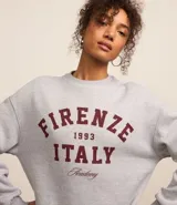 Buzo gris melange de algodón con felpa, con estampa localizada en el frente con la leyenda "Firenze 1993 Italy".