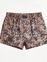 Bóxer de algodón con estampado abstracto en tonos tierra y negro, cintura elástica y etiqueta central.