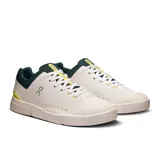 Championes urbanos The Roger Advantage 2, color blanco con detalles en verde y amarillo.