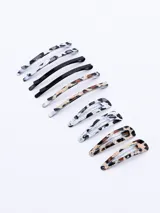 Set de 10 hebillas para el pelo con forma de pico de pato, con diferentes estampados animal print y lisas.