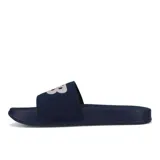 Chancletas azules con logo blanco en la tira superior.