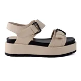 Sandalias negras con plataforma, tiras anchas con hebillas plateadas y ajuste con hebilla al tobillo.