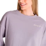 Buzo color crema de corte holgado, con cuello redondo y logo de la marca bordado en el pecho.