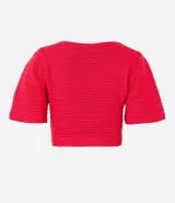Blusa cropped de punto color verde, con escote cruzado en V y mangas cortas.