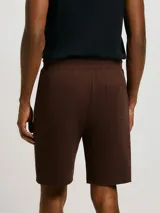 Bermuda básica de algodón color negro, corte recto y largo por encima de la rodilla, con cintura elástica ajustable con cordón.