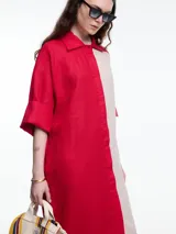 Vestido camisero largo de lino, con manga 3/4 y silueta relajada. Diseño con bloques de color en contraste blanco y negro.