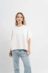 Buzo verde agua de algodón grueso, manga corta y corte oversize.