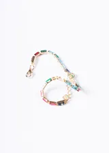 Pulsera tennis recta con zirconias multicolor y cadena dorada.