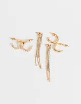 Set de tres pares de aros dorados: argollas con forma de corazón con strass, argollas clásicas y aros colgantes con lluvia de strass.