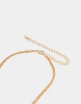 Cadena dorada de doble hilo, con dije de corazón con strass y dijes colgantes de corazón y torre Eiffel.