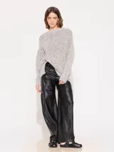 Sweater holgado color gris jaspeado, tejido en mezcla de algodón y lurex, con largo hasta la cadera.