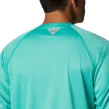Remera de manga larga Columbia Terminal Tackle Heat, color gris jaspeado, con logo de la marca en el pecho y en la manga. Confeccionada en tejido transpirable de secado rápido y protección solar UPF 50.