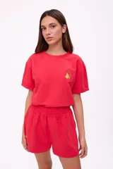 Short color crema de algodón y lino, con cintura elástica y bordado de un limón en el lateral.