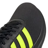 Championes Adidas Lite Racer 4.0, color negro con detalles en amarillo neón, ideales para uso urbano. Confeccionados en malla transpirable y suela Cloudfoam.