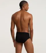 Calzoncillo slip blanco de poliamida con cintura elástica y logo Mash en negro.