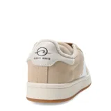 Championes urbanos negros con detalles en blanco, suela color crema y logo en el lateral.
