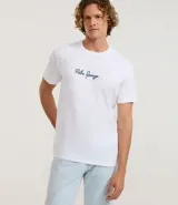 Remera blanca de algodón con cuello redondo y mangas cortas. Estampa frontal y trasera con la frase "Palm Springs" en color verde.