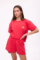 Short color crema de algodón y lino, con cintura elástica y bordado de un limón en el lateral.