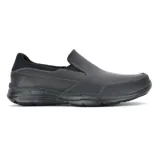 Mocasín Skechers Relaxed Fit Glides, color negro, con capellada de cuero, costuras decorativas y plantilla Gel Infused Memory Foam. Diseño Wide Fit de horma ancha.