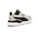 Championes Puma Anzarun Lite Slipon color gris claro con detalles en negro y blanco. Diseño slip-on con banda elástica con logo Puma en el empeine y suela blanca.