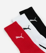 Pack de tres pares de medias Puma de caña media, en colores negro, blanco y rojo, con logo de la marca en el tobillo y detalle de rayas en el talón.