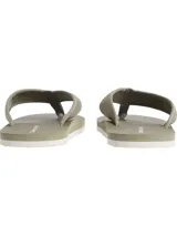 Ojotas Calvin Klein Jeans color verde oliva con base texturizada y tiras de lona con logo CK.