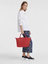 Cartera tote plegable de nylon color negro con cierre y asa corta, modelo Le Pliage Green.