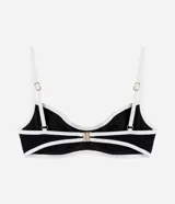 Top de bikini negro con detalle de bies blanco contrastante, de microfibra, con tirantes ajustables y cierre en la espalda.