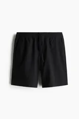 Short negro de lino y algodón, con cintura elástica y cordón ajustable.